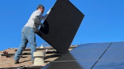 Sussex Solar Installers fitting solar panels to a roof